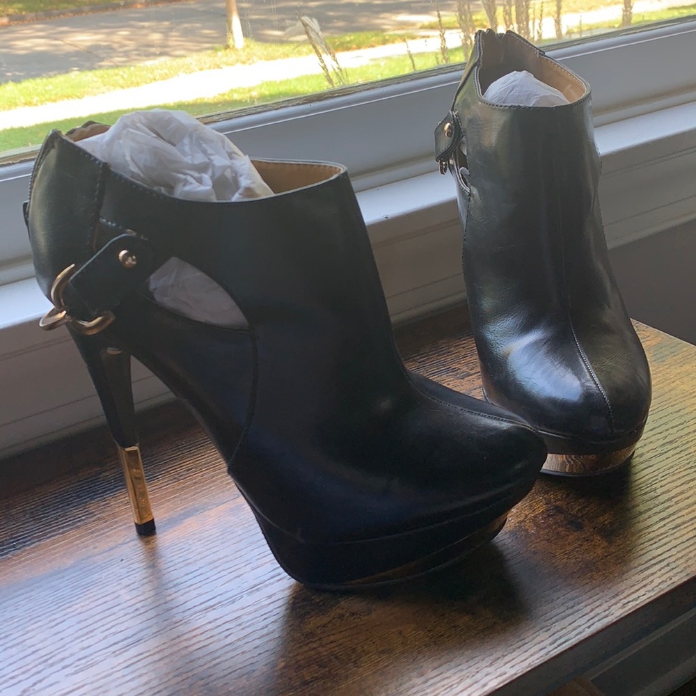 Gently used black and gold platform booties